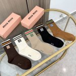 A box of four pairs of Miu Miu high-quality, super popular trending socks, featu