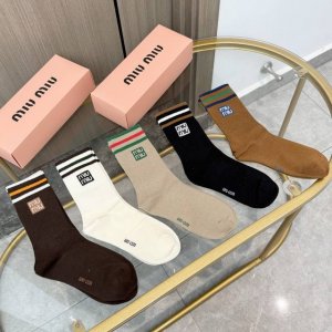 A box of four pairs of Miu Miu high-quality, super popular trending socks, featu