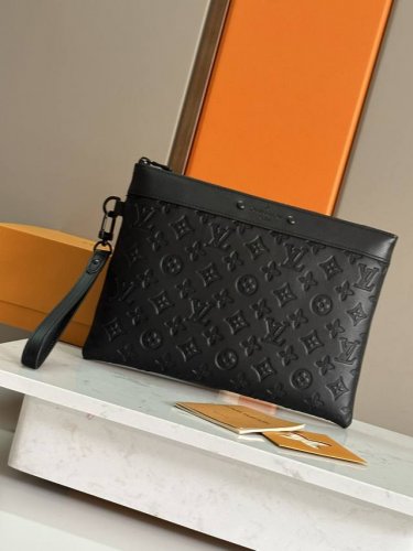 This new black Pochette To-Go clutch, made from Monogram Shadow embossed leathe