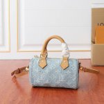 M11212 This Nano Speedy bag features a Monogram pattern woven from cotton denim,