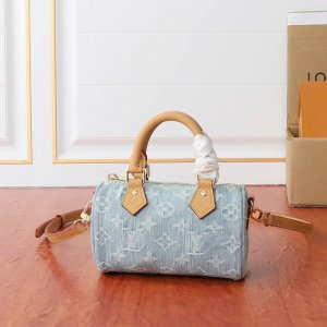 M11212 This Nano Speedy bag features a Monogram pattern woven from cotton denim,