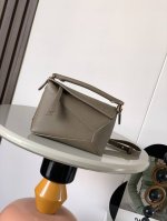 A hot new geometric bag. The mini 18cm Puzzle handbag in genuine imported pebble