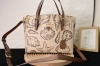 Coa*H Coach's new July model, Cbh63, features a beach shell print Mollie tote in