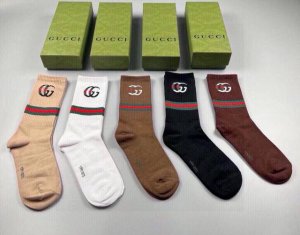 Gucci's newest knee-high socks, five pairs per box. The double G logo at the cu