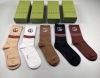 Gucci's newest knee-high socks, five pairs per box. The double G logo at the cu