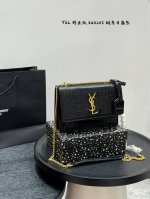 comes with a gift box Romantic city, the Yves Saint Laurent Sunset bag with cro