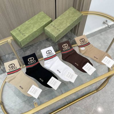 A box of five Gucci socks with packaging