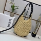 Luojia Punch Hole Hobo Straw Bag Combining a soft, hand-woven raffia body with
