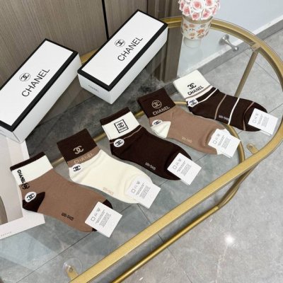 A box of five Chanel mid-calf socks, high-quality replica, complete with packagi