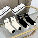 A box of four pairs of Chanel high-quality, super popular trending socks, featur