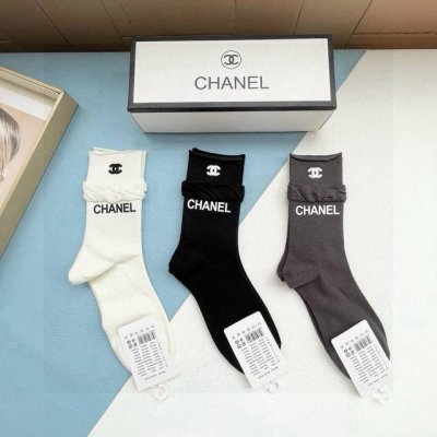 A box of three pairs of Chanel's popular mid-calf socks, high-quality replica, c