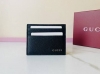 A premium Gucci-logo card holder. This men's everyday accessory is updated with
