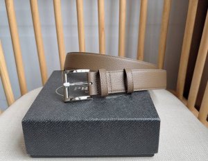 This is the latest Prada leather belt from the boutique. The tip is adorned wit This is the latest Prada leather belt from the boutique. The tip is adorned wit