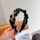 with packaging Yves Saint Laurent's new trendy high-end pleated headband, simpl