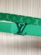 New for the season, the 40mm reversible belt features a soft green swastika on