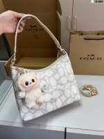 with Labubu pendant Coach hobo bag Full of design sense Super high-end fashion
