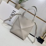 Lw's new mini Puzzle Fold handbag in grained calfskin draws inspiration from the