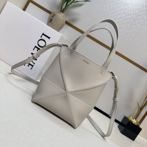 Lw's new mini Puzzle Fold handbag in grained calfskin draws inspiration from the