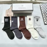 A box of five Chanel high socks, including packaging. High-quality replica of Ch