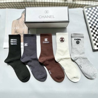 A box of five Chanel high socks, including packaging. High-quality replica of Ch
