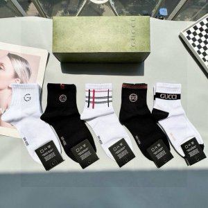 Includes packaging. A box of five Gucci mid-calf socks