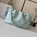 The Flamenco Purse bag in low, soft nappa leather features a pleated design and