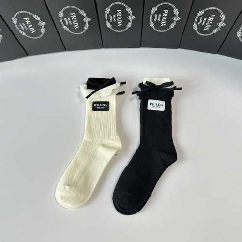 Special packaging for Prada's new cashmere slouch socks! Two pairs per box, same