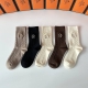 Specially packaged Hermes cashmere embroidered mid-calf socks! Five pairs per bo