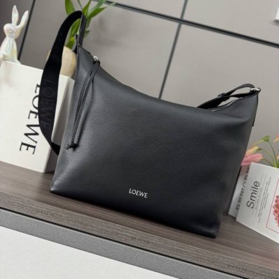 Low new soft grained cowhide crossbody bag. This spacious and soft bag easily ad