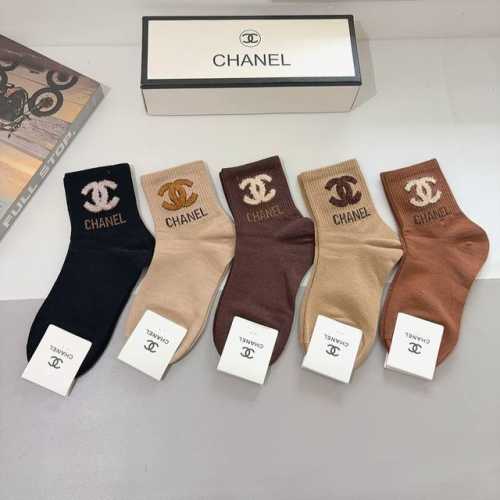 A box of 5 pairs of Chanel classic mid-calf socks with the iconic double C logo.