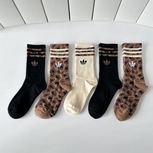 Specially packaged Adidas Originals mid-length slouch socks! Five pairs per box,