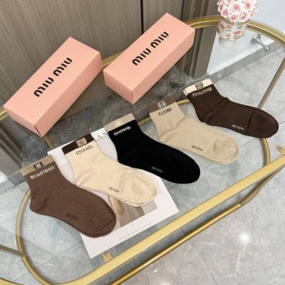 A box of five pairs of high-quality, super popular mid-calf socks from top Europ