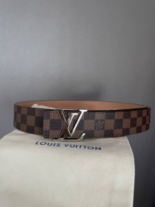 Louis Vuitton's iconic monogram metal buckle with classic Damier monogram patte