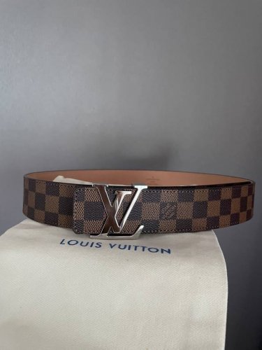Louis Vuitton's iconic monogram metal buckle with classic Damier monogram patte