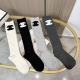 A box of four pairs of Chanel socks with packaging. These super popular Chanel s