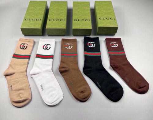 Gucci's newest knee-high socks, five pairs per box. The double G logo at the cu