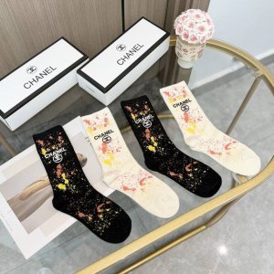 A box of four pairs of Chanel's popular mid-calf socks, high-quality replica, co