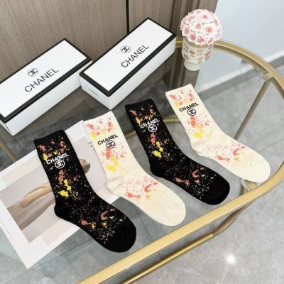 A box of four pairs of Chanel's popular mid-calf socks, high-quality replica, co