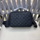 Louis Vuitton's printed embossed messenger bag, a classic travel accessory, is