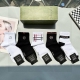 Includes packaging. A box of five Gucci mid-calf socks