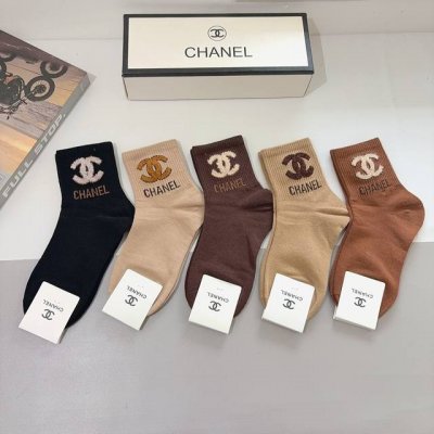 A box of 5 pairs of Chanel classic mid-calf socks with the iconic double C logo.