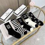 A box of five pairs of Chanel high-quality, super popular trending socks, featur