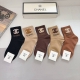 A box of 5 pairs of Chanel classic mid-calf socks with the iconic double C logo.