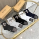 A box of five pairs of Burberry mid-calf socks, including packaging. These are t