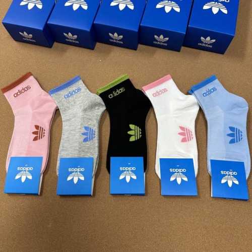 Adidas new women's mid-calf socks, featuring the wildly popular trefoil logo des