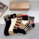 A box of 5 pairs of Burberry classic logo mid-calf socks, including packaging. A