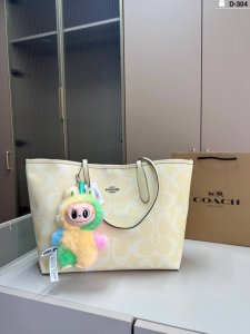 with Labubu pendant Coach shopping bag Whether it is a long trip or a short out