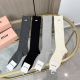 A box of four pairs of Miumiu socks with packaging. These super popular Miumiu s