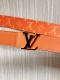 New for the season, the 40mm reversible belt features a soft orange cross patte