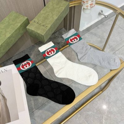 A box of three pairs of Gucci mid-calf socks, high-quality version, comes with p